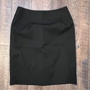 Knee-length lined black skirt